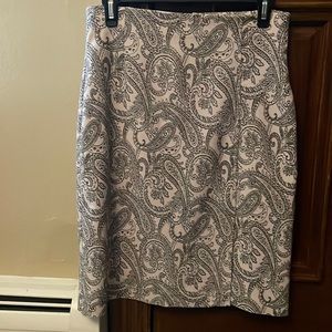 Alanni tan and black stretchy pencil skirt with side slit. Size 4.
